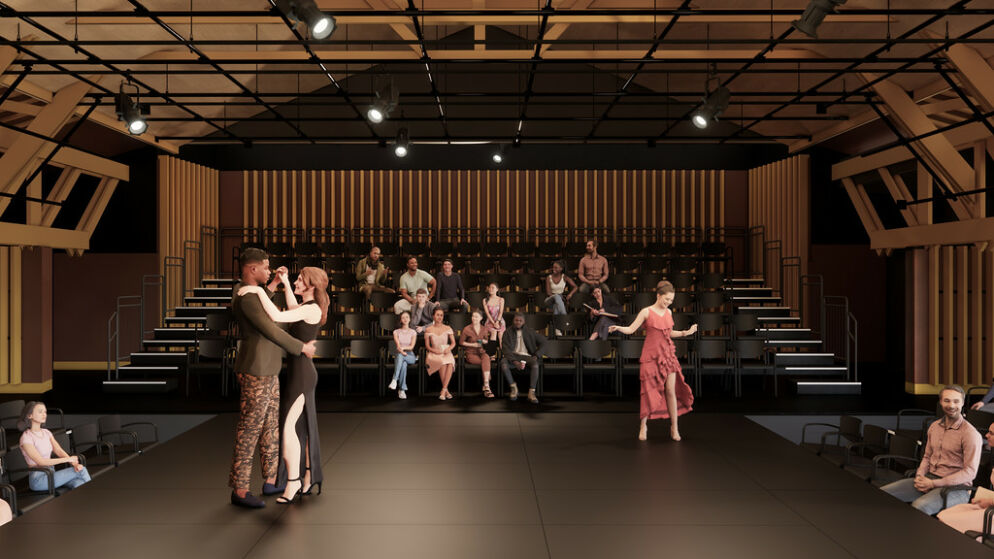 Photo of a large stage where couples dressed in elegant outfits are dancing together.