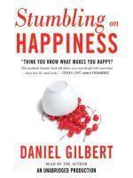 Photo of a white book cover titled "Stumbling on Happiness" in large red font at the top, above smaller black text that reads "Think you know what makes you happy?" Below that is an overturned white bowl of maraschino cherries.