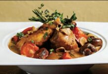 A Stress-Free Make-Ahead Holiday Party Dish Photo of a chicken dish garnished with sprigs of parsley.