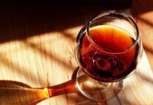 Crafty Wine Night, Juneteenth and More in MoCo: June 13-15 Stock photo of a glass of port wine atop a wooden table.