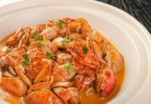 Crab Dinner, Outdoor Movie and More in MoCo This Weekend: July 26 Stock photo of a plastic white plate filled with crab and seafood.