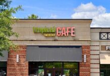 Tropical Smoothie Cafe Opens Second Gaithersburg Location Photo of the exterior of a cafe building with a small black awning. The sign reads "Tropical Smoothie Cafe."