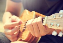 Person playing a guitar