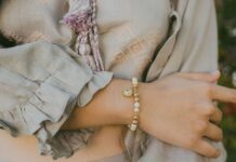 Woman wearing a charm bracelet