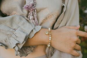 Woman wearing a charm bracelet