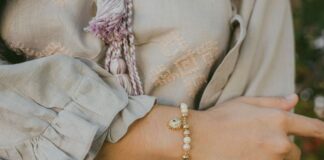 Woman wearing a charm bracelet