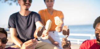 People toasting with ice cream bars