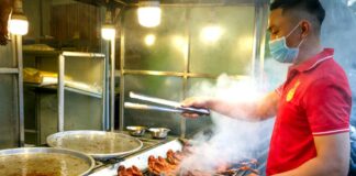 A man making barbecue chicken