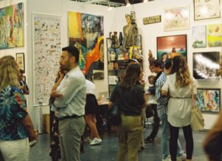 Things to Do This Weekend in Montgomery County (Sept. 4-7) People looking at paintings in an art gallery