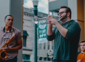 Several men playing jazz instruments outside