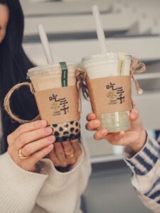 Two people toasting with bubble tea