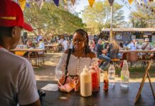 Things to Do This Weekend in Montgomery County (Oct. 3-4) A woman buying food at a food festival