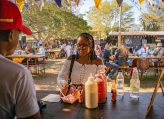 Things to Do This Weekend in Montgomery County (Oct. 3-4) A woman buying food at a food festival