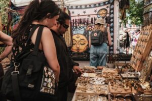 People looking at a booth at a craft fair