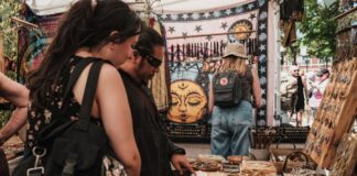 People looking at a booth at a craft fair