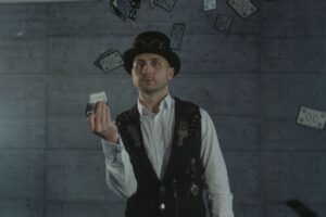 Magician throwing playing cards